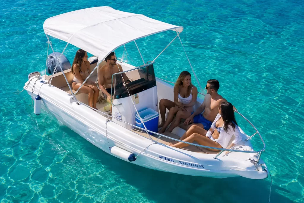 Boat rental in Ksamil departing from Butrint with tourists exploring the Albanian Riviera