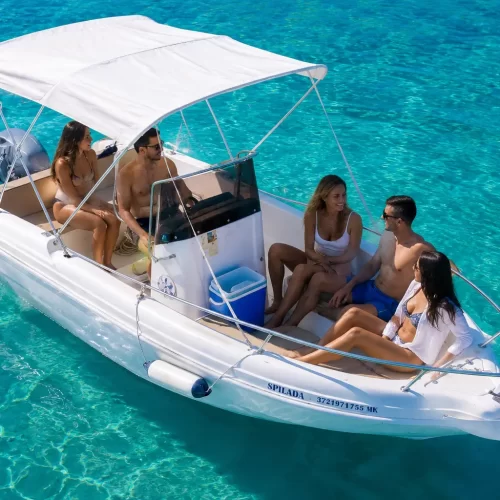Boat rental in Ksamil departing from Butrint with tourists exploring the Albanian Riviera